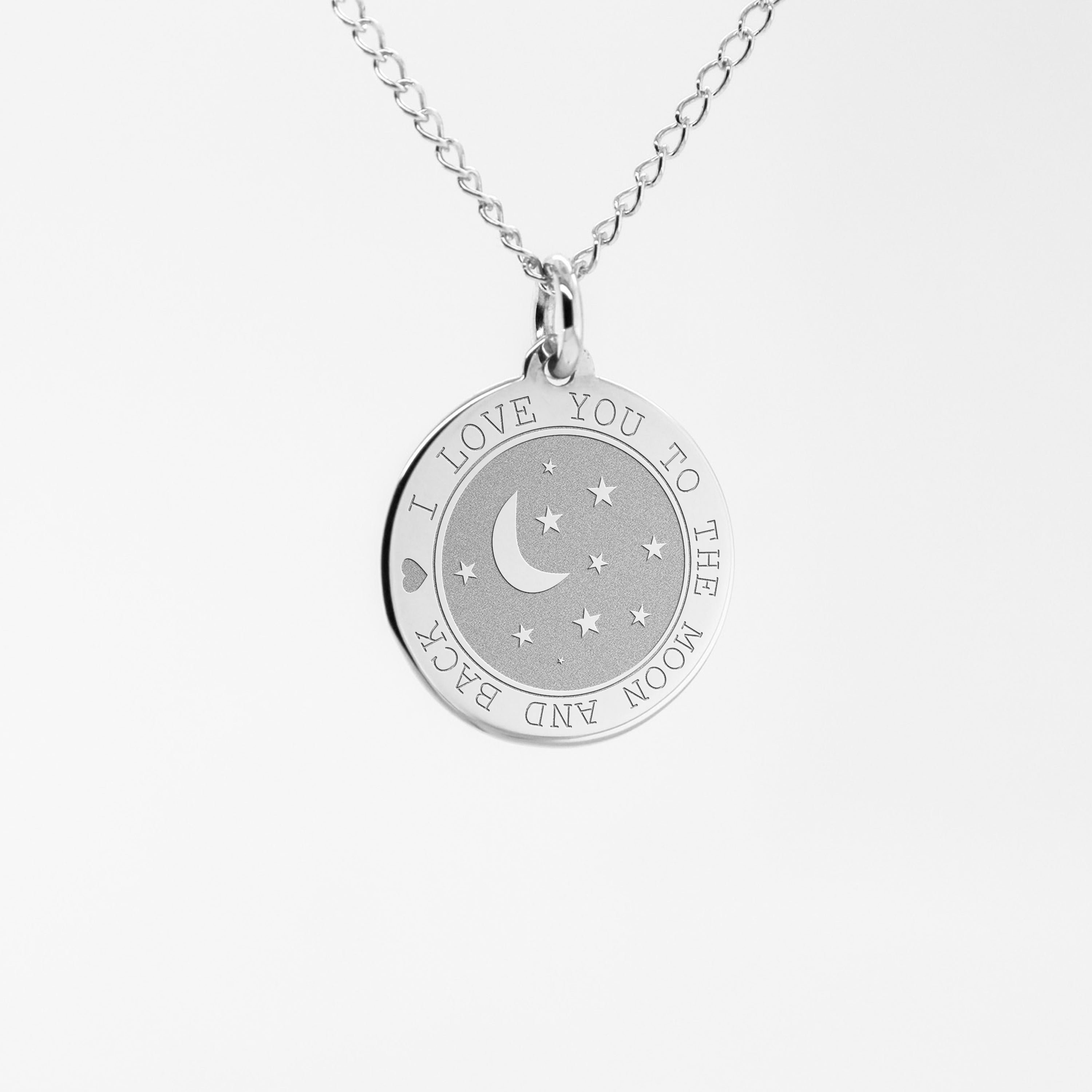 a silver necklace with a crescent and stars on it